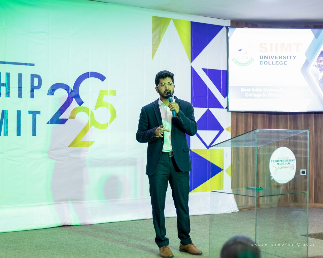Speaker presenting on stage at the EME Summit 2025