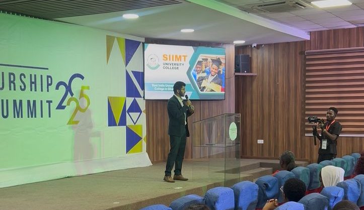 A speaker presenting to a seated audience in the hall at the EME Summit 2025